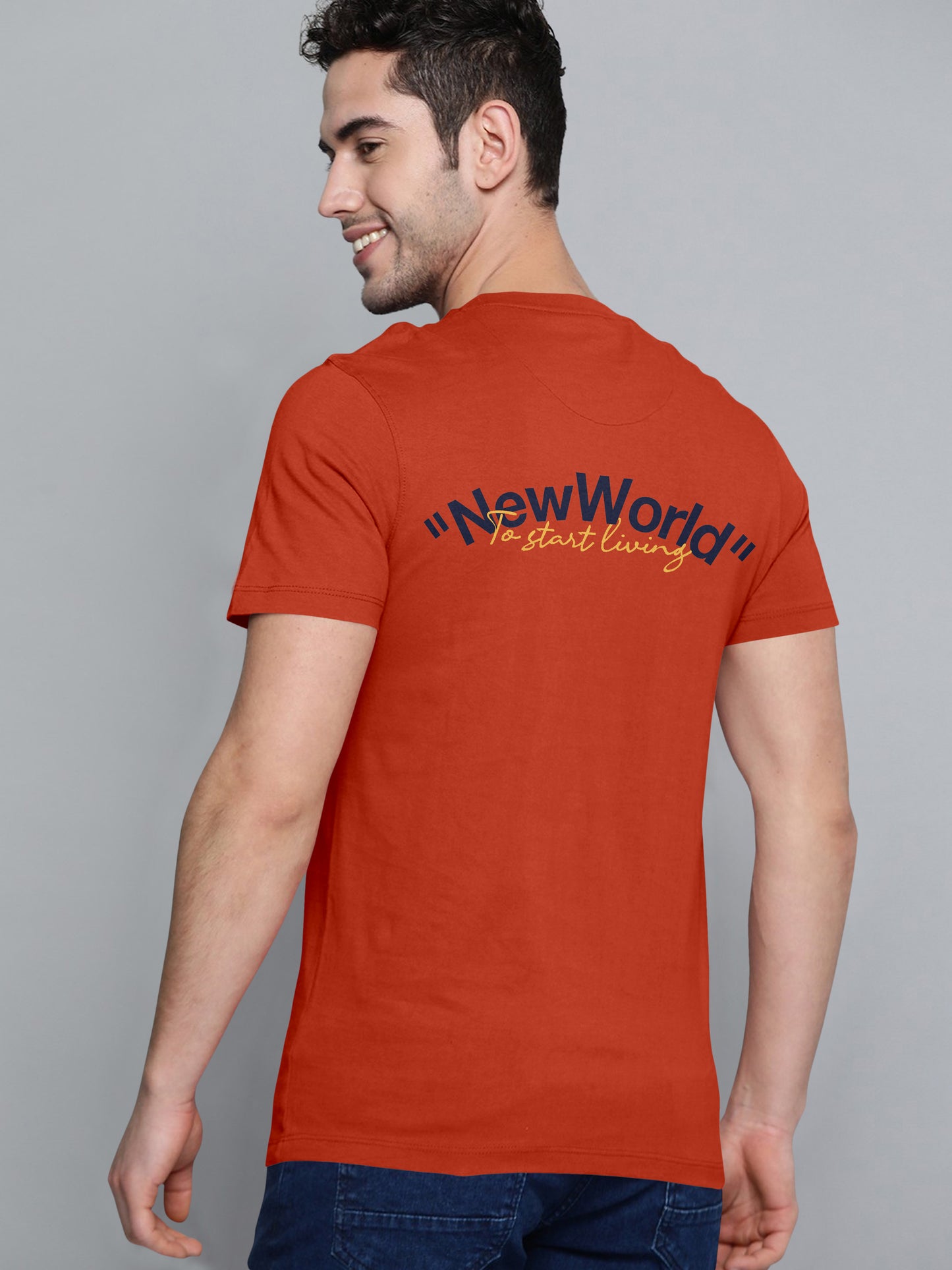 Man wearing orange t-shirt with 'New World To start living' text on the back