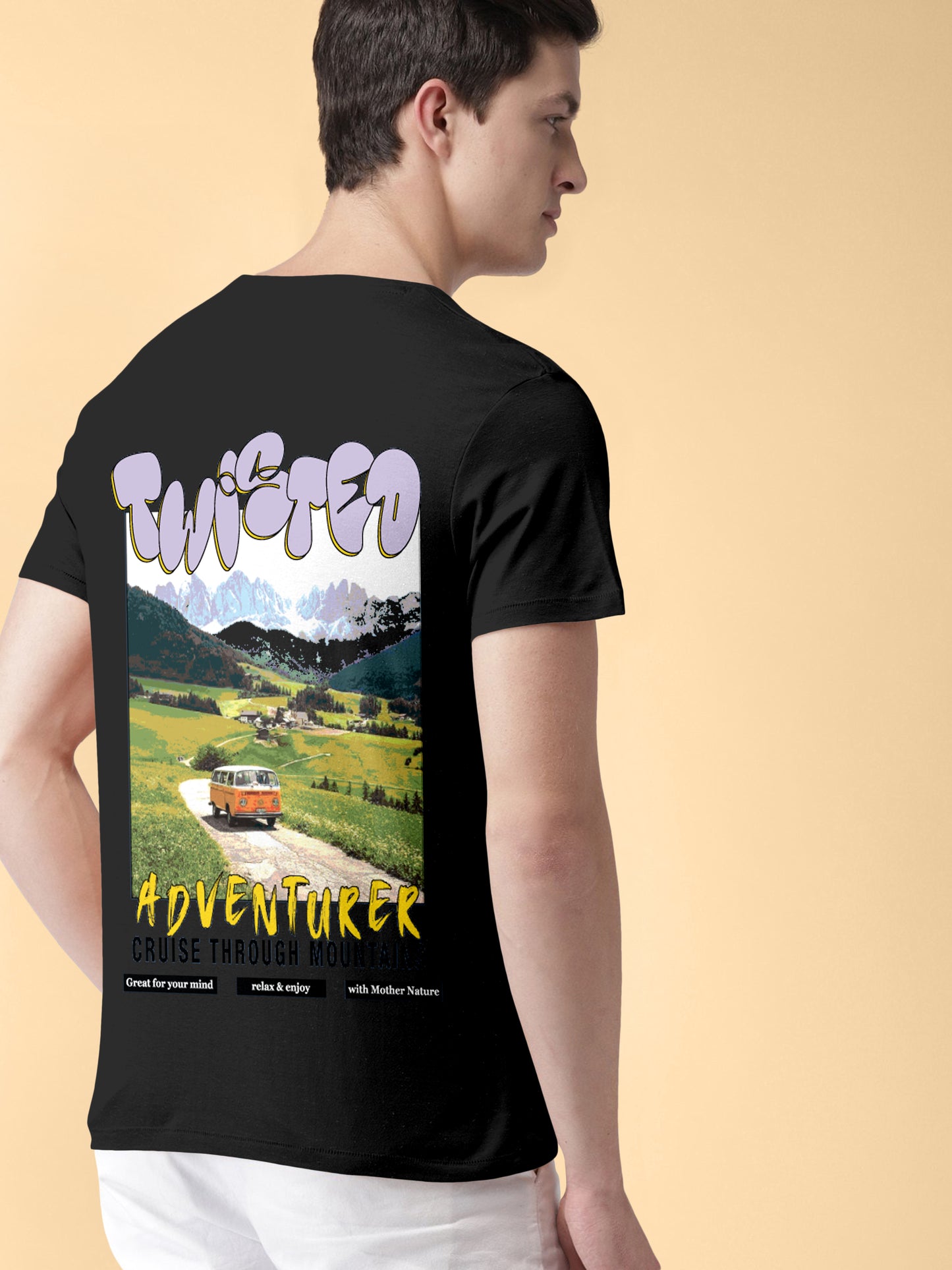 Man wearing black graphic t-shirt with 'Twisted Adventurer' mountain and van design on the back