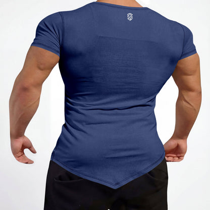 Man wearing navy blue fitted athletic t-shirt with pointed hem and shorts, back view